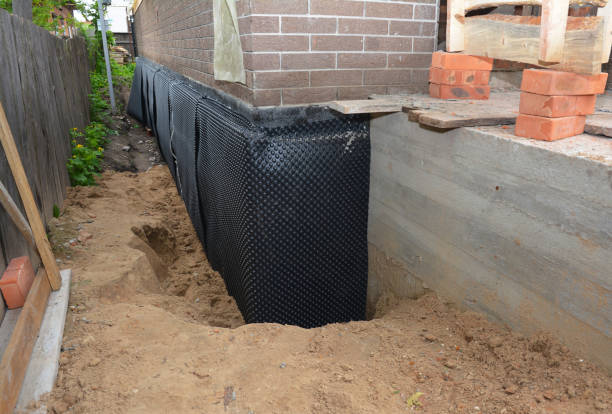 SJ Waterproofing Pros technician performing targeted Vapor Barrier Installation assessment in Oneida, WI